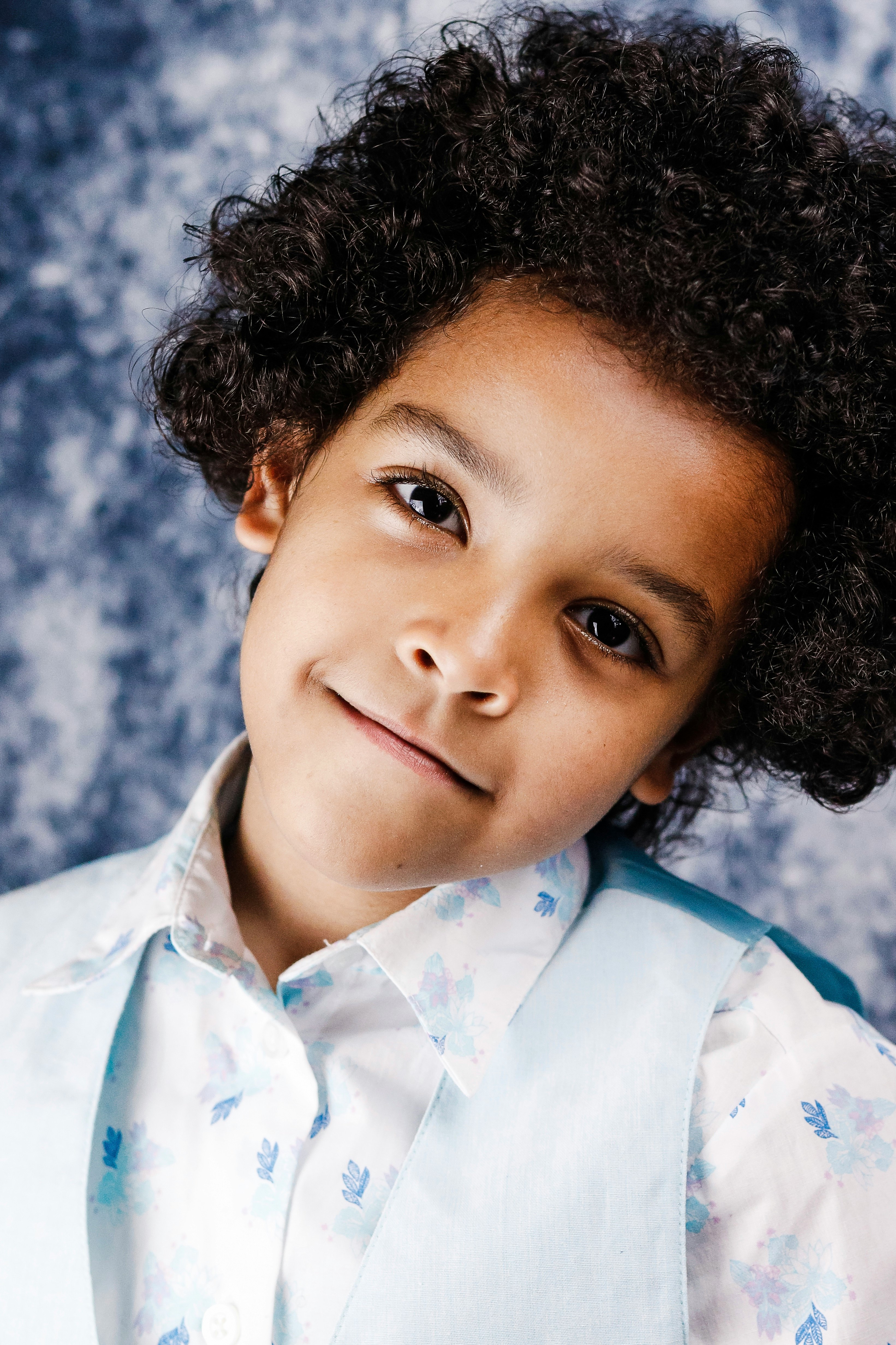 woman in white and blue floral button up shirt